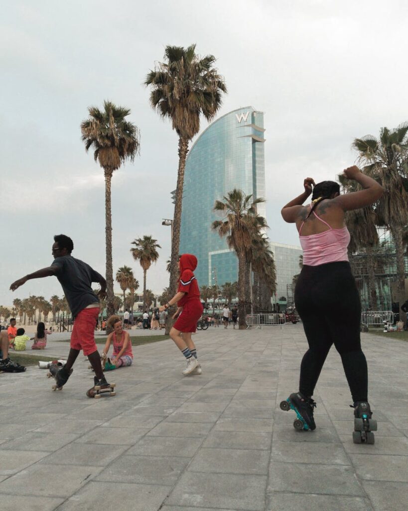A diverse group of roller skaters having fun in an urban park near the W Hotel, Barcelona.