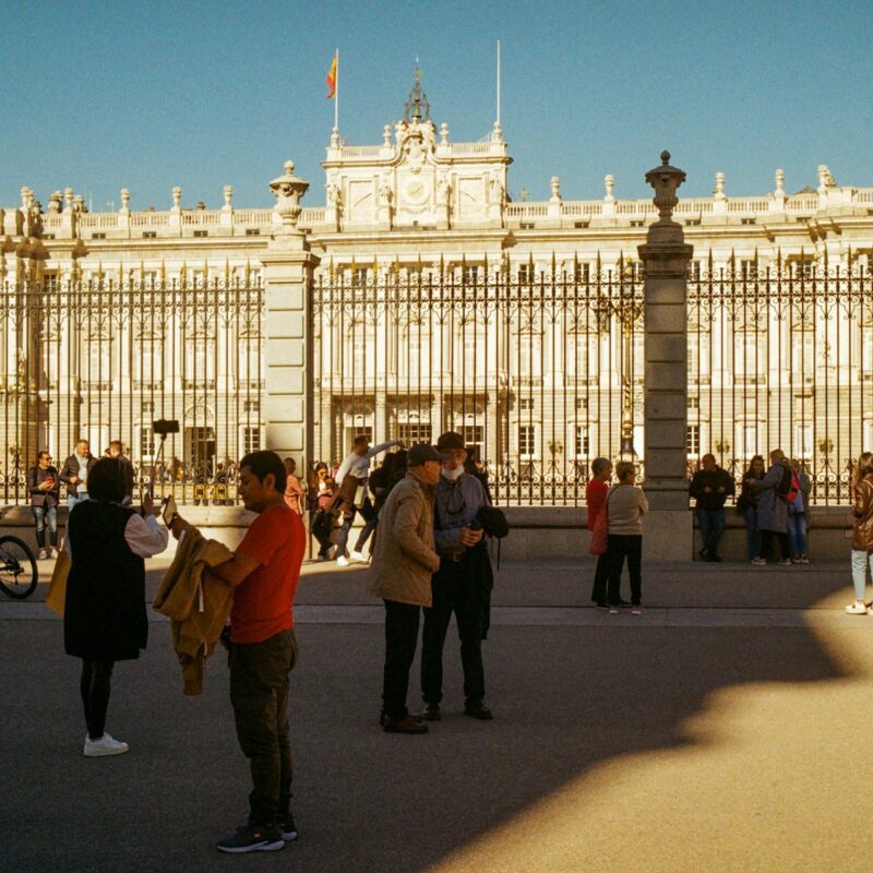 a group of people standing in front of a building