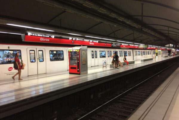 Commuters at Glòries metro station in Barcelona, capturing urban transit moments.