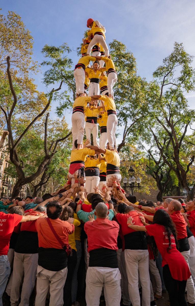 a group of people standing around a large float