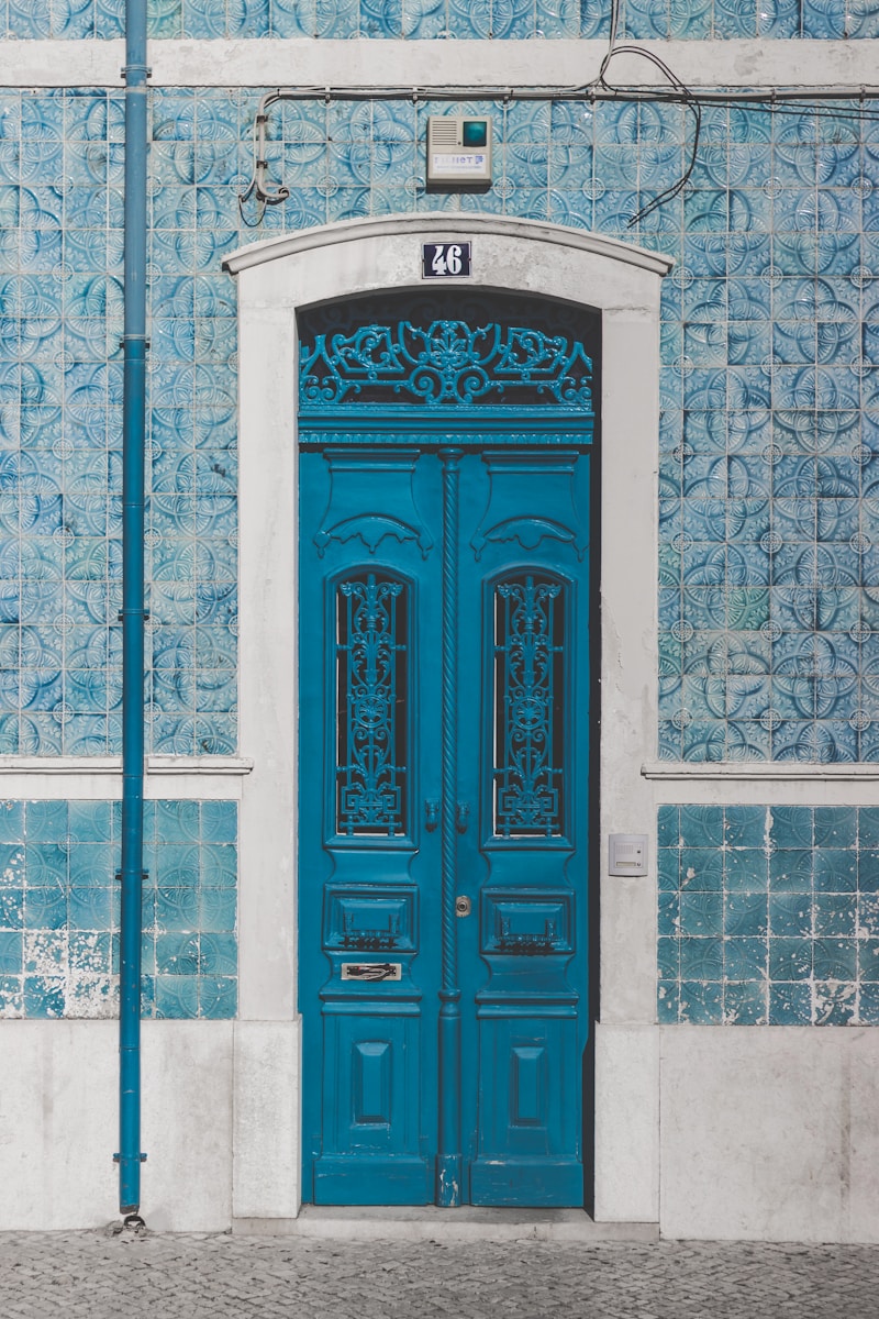 blue wooden door closed with 46 sign