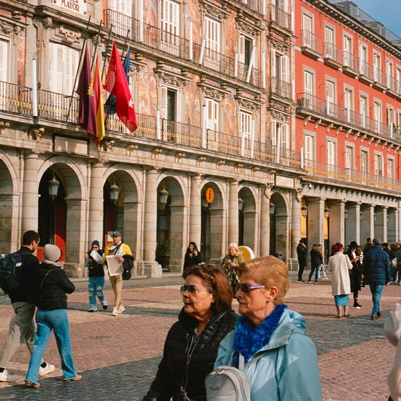 a group of people standing in front of a building