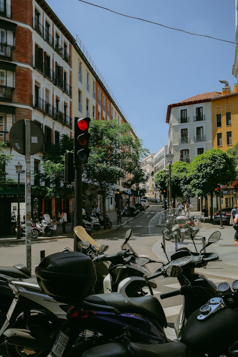 a group of motorcycles parked next to each other on a street