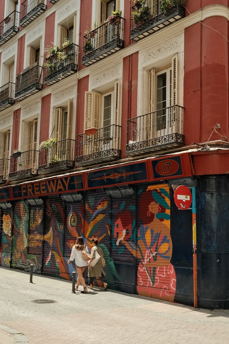 a couple of people that are standing in front of a building