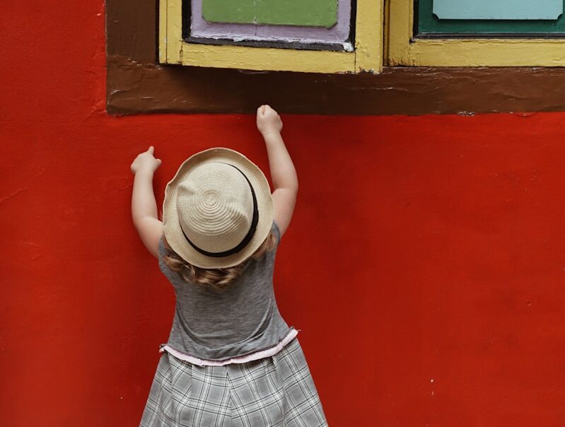 shallow focus photo of toddler wearing gray hat